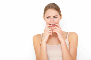 Calgary counselling services afraid woman in white tank top